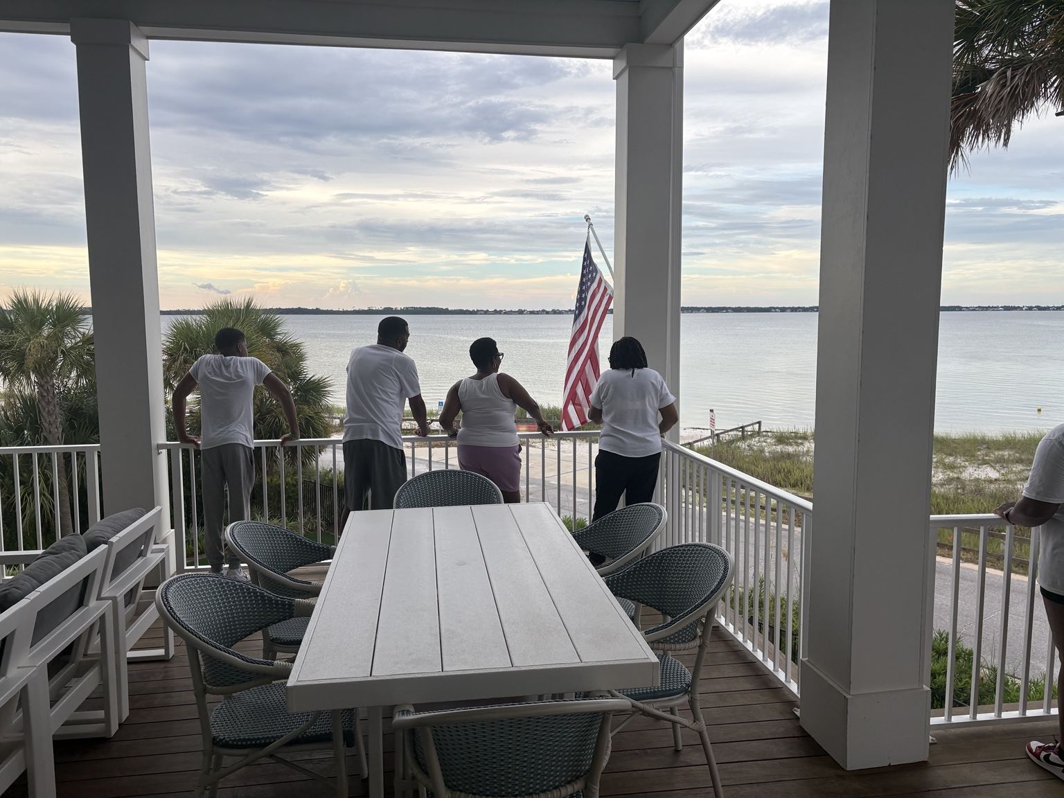 Family enjoying the waterfront view from the beach house