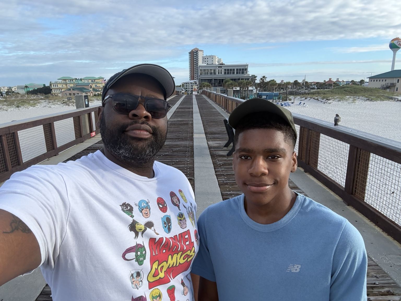 Father and son enjoying time on the pier