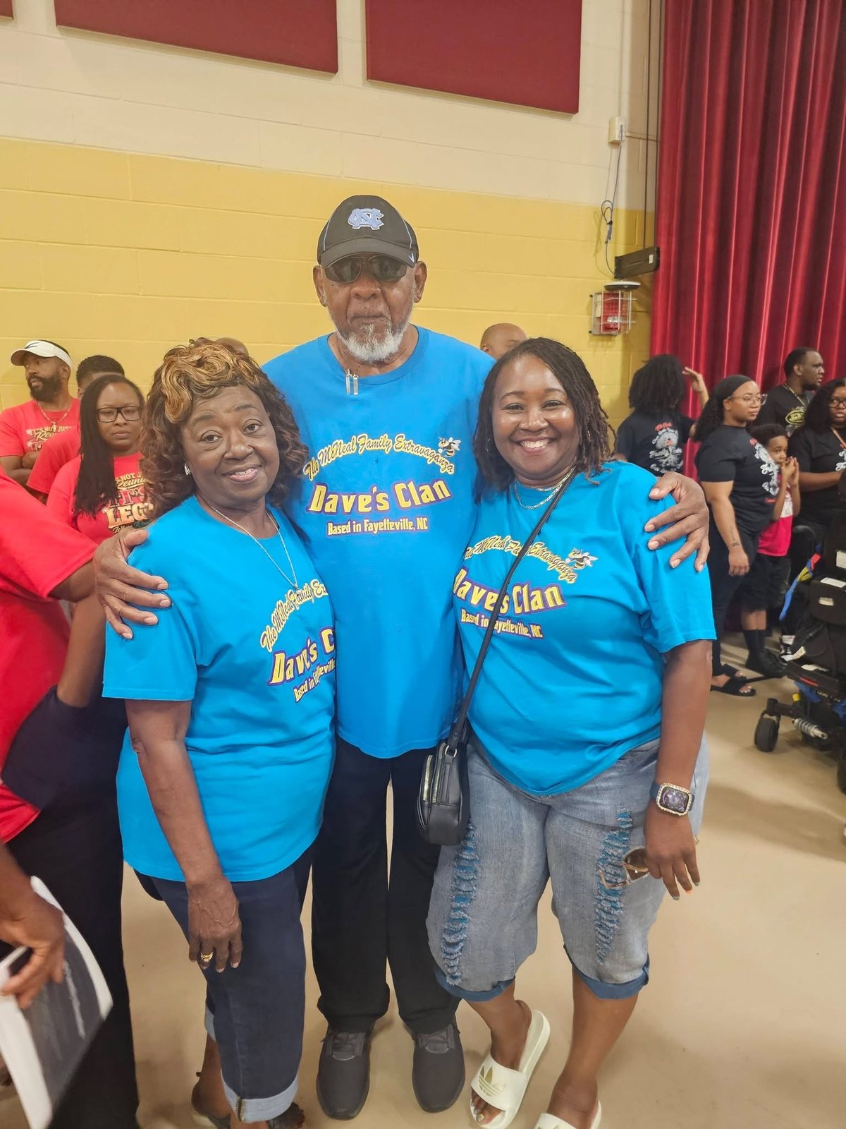 Three generations smiling together at the reunion