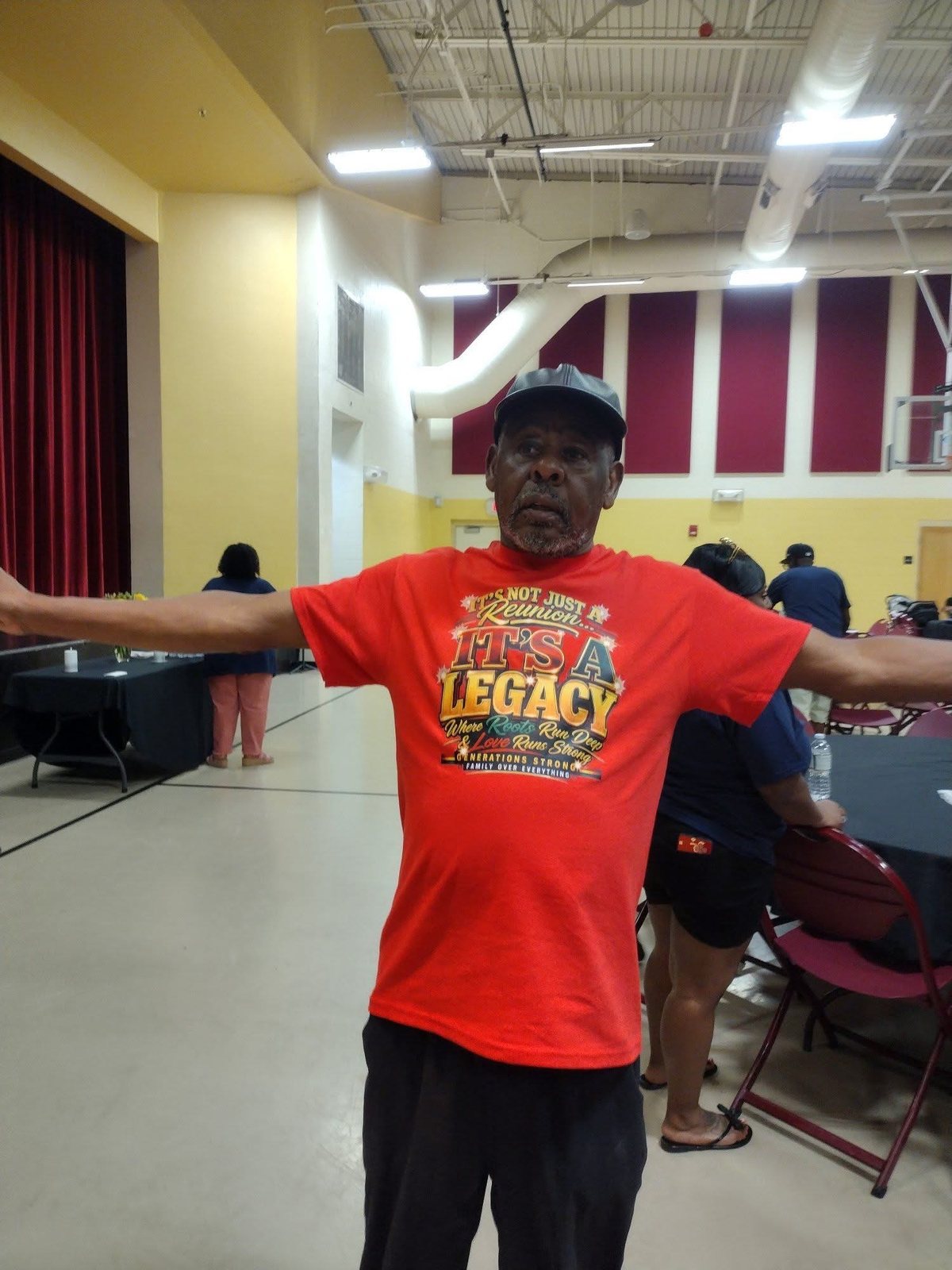 Family elder showing off the reunion shirt