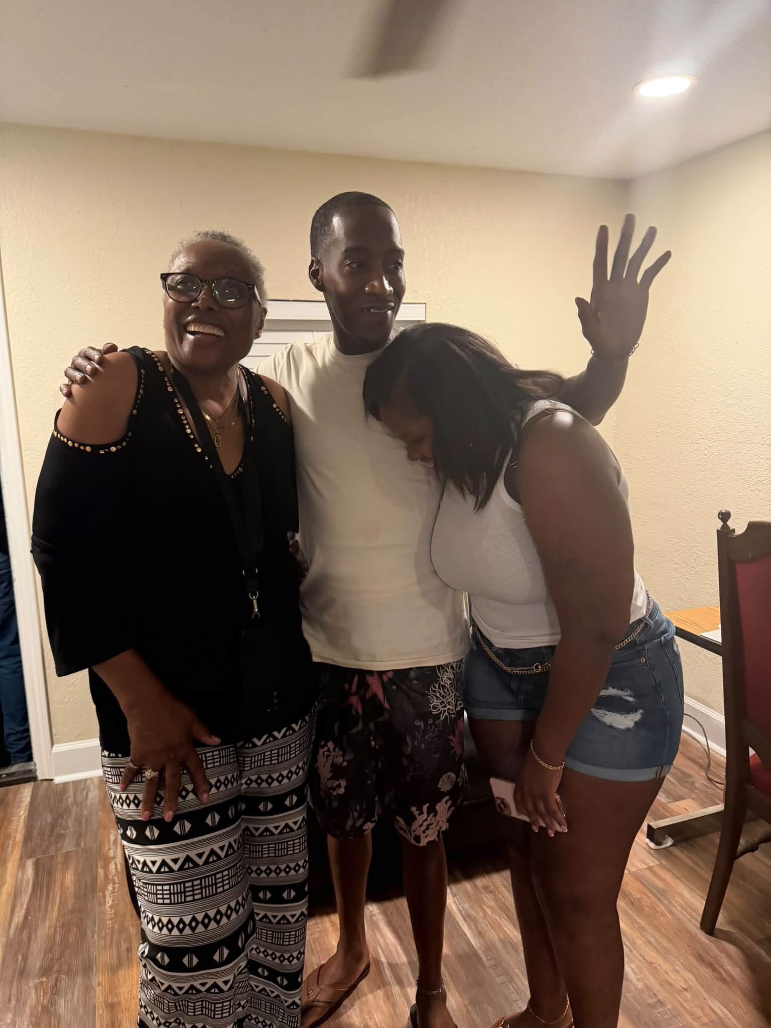 Family members smiling together at the reunion house